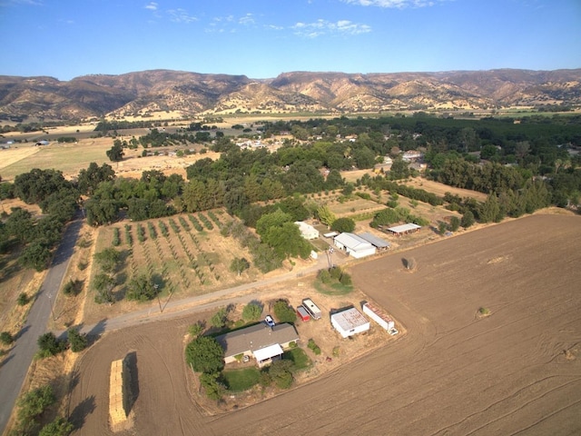 drone / aerial view with a mountain view and a rural view