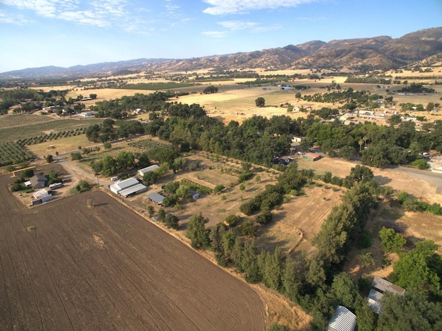 drone / aerial view with a mountain view and a rural view