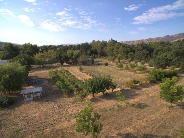 exterior space with a rural view and a mountain view