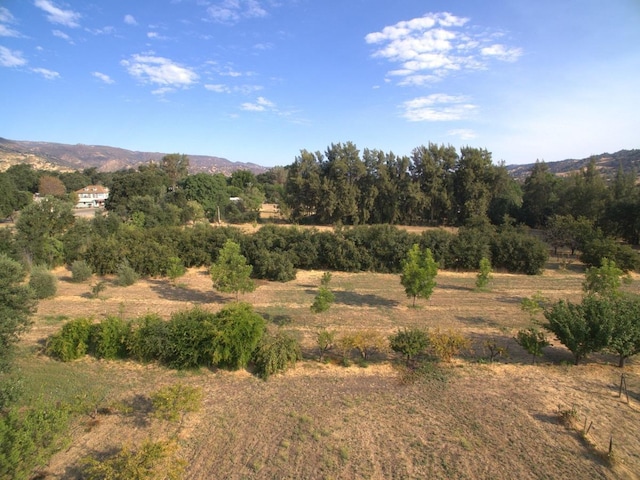 property view of mountains featuring a rural view