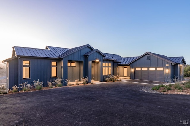 modern farmhouse featuring a garage