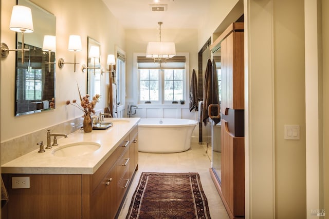 bathroom with tile patterned flooring, a notable chandelier, vanity, and plus walk in shower