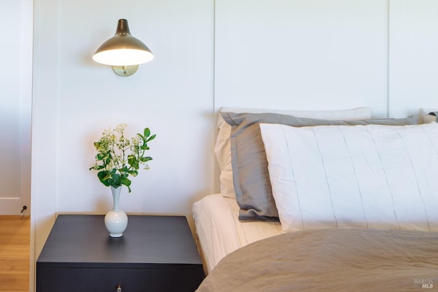 bedroom with wood-type flooring