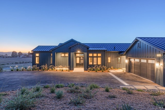 modern inspired farmhouse featuring a garage