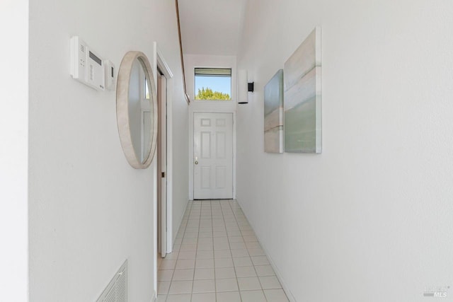 hallway featuring light tile patterned flooring