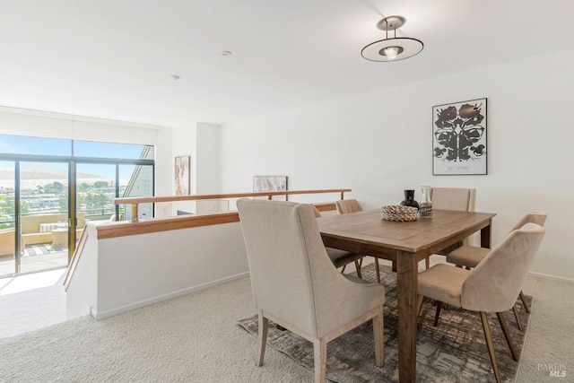 view of carpeted dining area