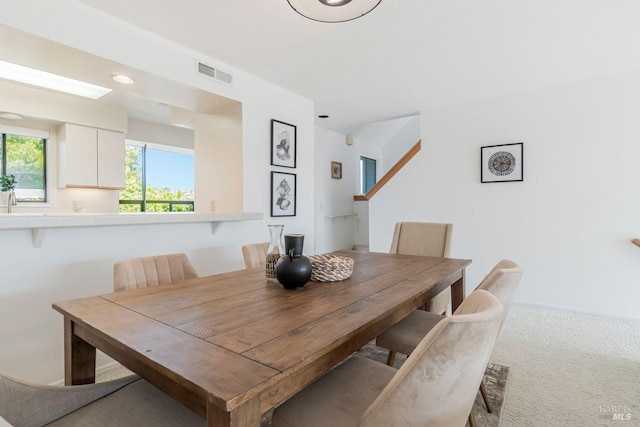 view of carpeted dining space