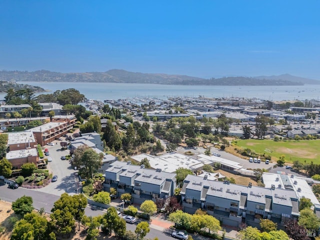 aerial view featuring a water and mountain view