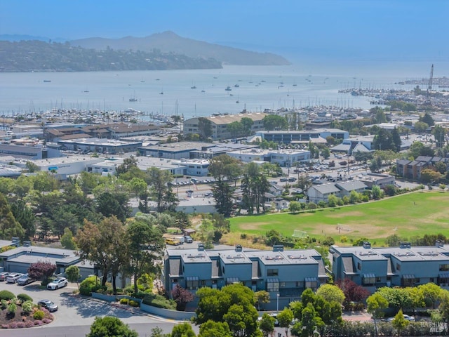 drone / aerial view featuring a water and mountain view