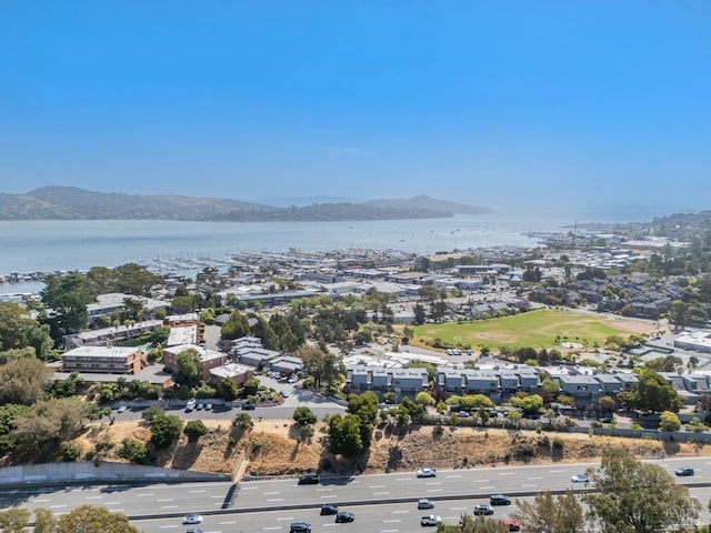 birds eye view of property featuring a water and mountain view