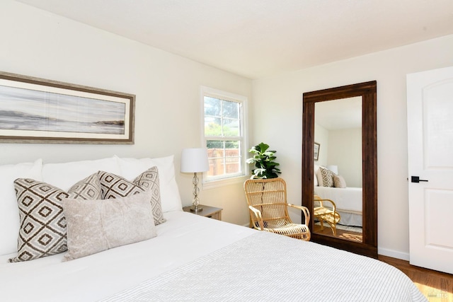 bedroom with hardwood / wood-style floors