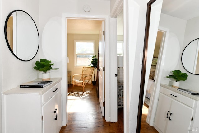 hall with hardwood / wood-style flooring