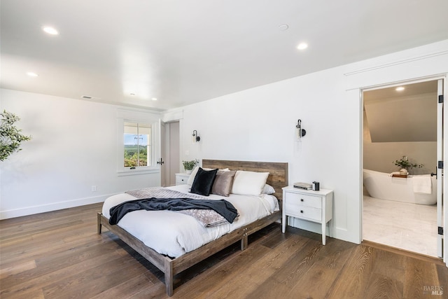 bedroom with dark hardwood / wood-style flooring