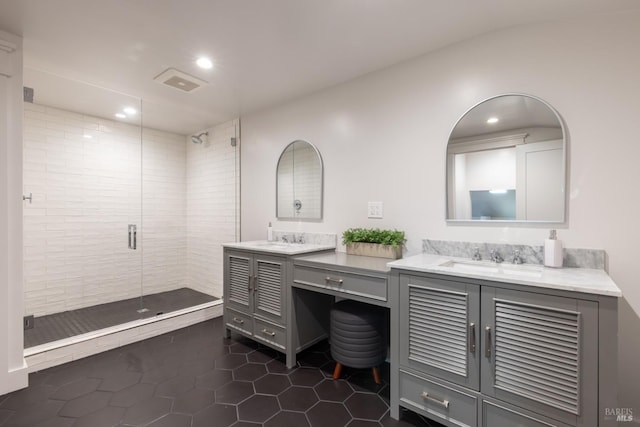 bathroom with vanity, tile patterned floors, and walk in shower