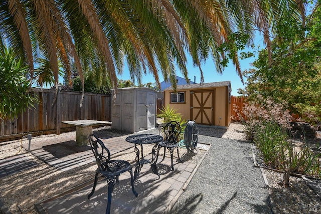 view of patio featuring a storage unit