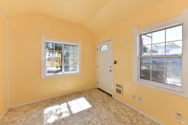 entrance foyer with lofted ceiling and heating unit