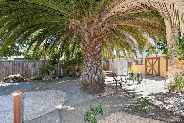 view of patio / terrace with a storage shed