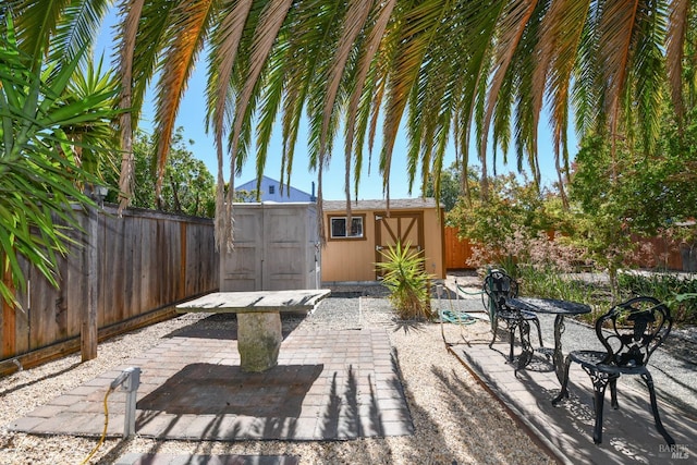 view of patio / terrace featuring a shed