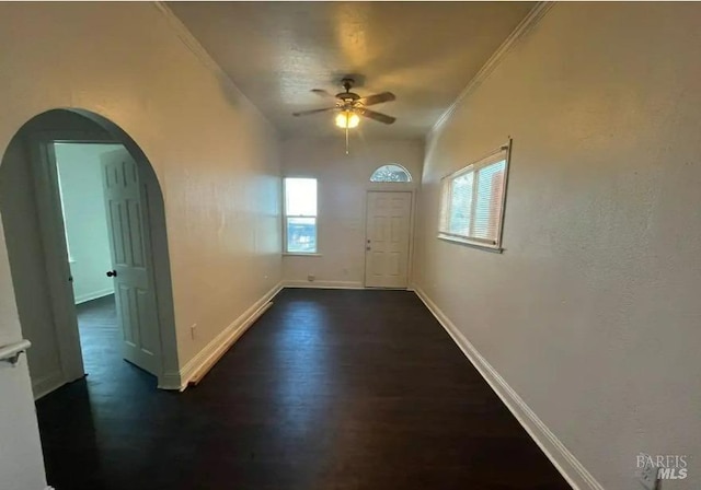 entryway with ceiling fan, dark hardwood / wood-style flooring, and ornamental molding