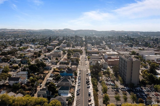 birds eye view of property with a mountain view