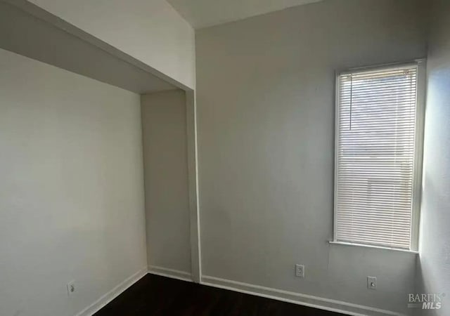 unfurnished room with hardwood / wood-style flooring