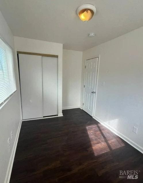 unfurnished bedroom featuring wood-type flooring