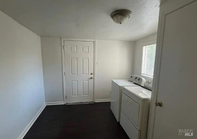 clothes washing area featuring washing machine and clothes dryer