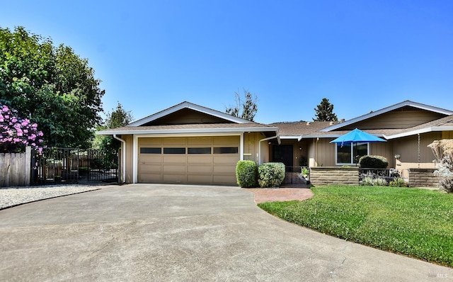 ranch-style home featuring a garage and a front yard