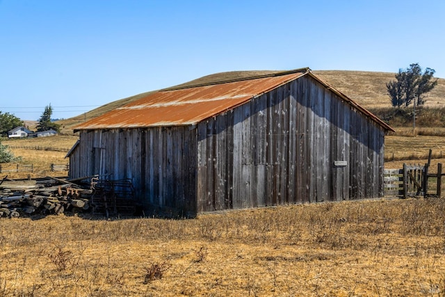 view of pole building with fence