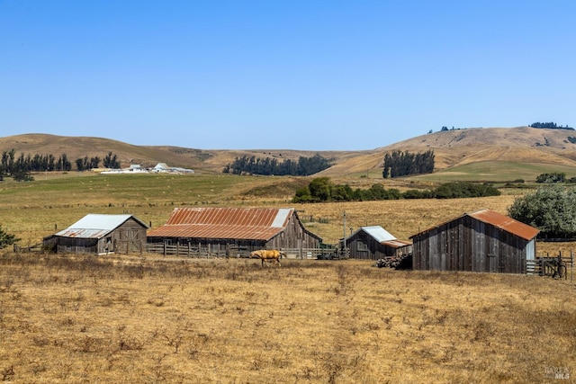 mountain view featuring a rural view
