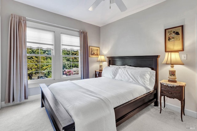 bedroom with light carpet and ceiling fan