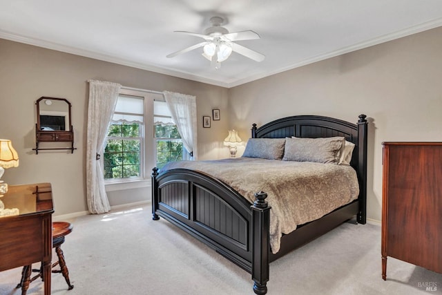 bedroom with ceiling fan, ornamental molding, and light colored carpet