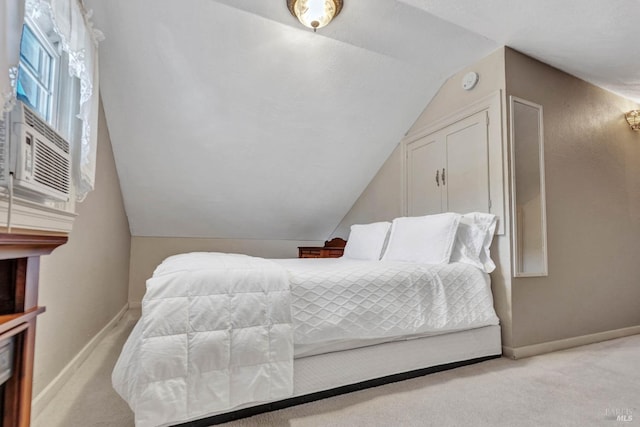 bedroom featuring cooling unit, lofted ceiling, and light colored carpet