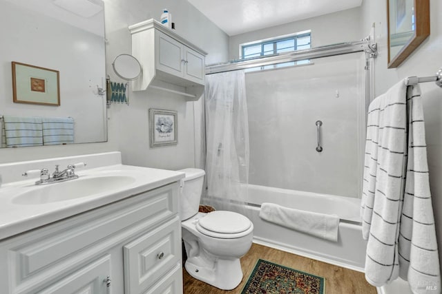 full bathroom featuring vanity, toilet, wood-type flooring, and shower / bath combo