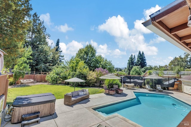 view of pool featuring a patio area, a lawn, and a hot tub