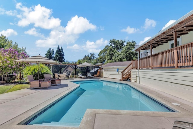 view of pool featuring a patio area