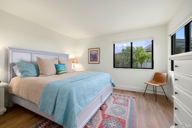 bedroom with light hardwood / wood-style flooring