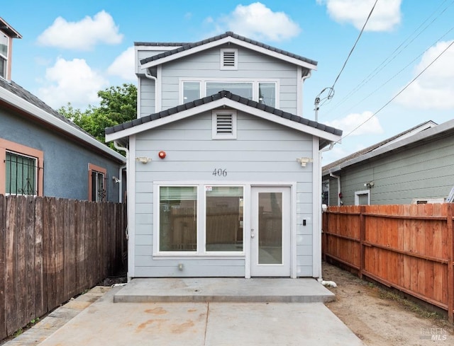 rear view of property with a patio area