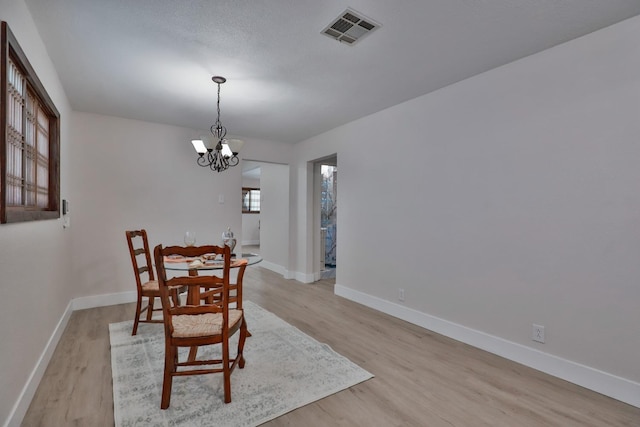 14090 Pine St, Walnut Grove, CA 95690 - dining area featuring a chandelier and light wood finished floors