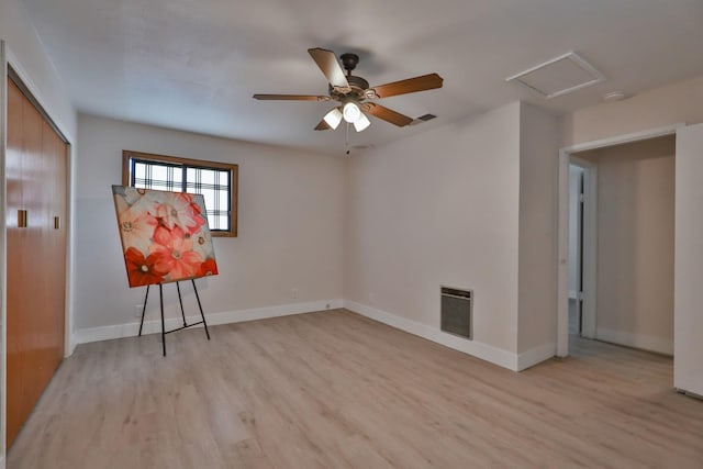 14090 Pine St, Walnut Grove, CA 95690 - unfurnished bedroom with heating unit, light wood-type flooring, attic access, a closet, and a ceiling fan
