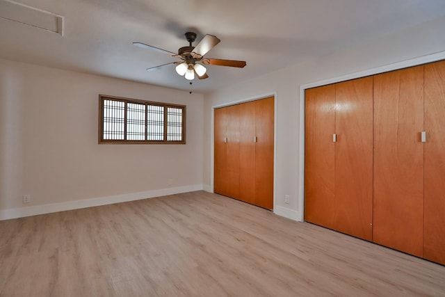 14090 Pine St, Walnut Grove, CA 95690 - unfurnished bedroom featuring two closets, light wood-style floors, and ceiling fan