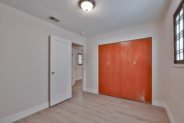 14090 Pine St, Walnut Grove, CA 95690 - unfurnished bedroom with light wood-style floors and a closet