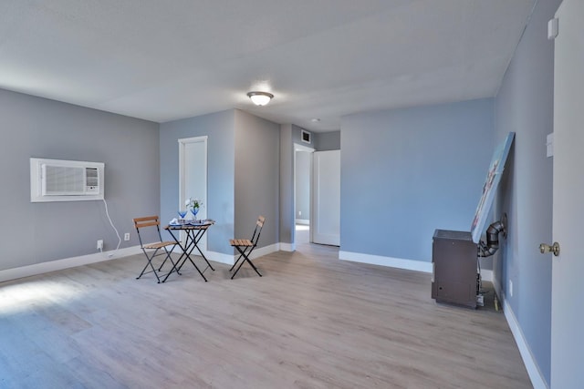 14090 Pine St, Walnut Grove, CA 95690 - living area featuring wood finished floors and a wall unit AC