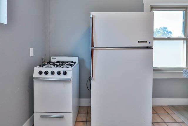 14090 Pine St, Walnut Grove, CA 95690 - kitchen with white appliances and light tile patterned floors