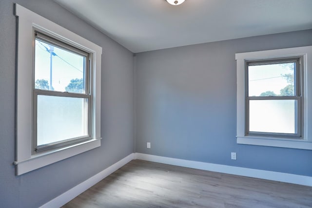 14090 Pine St, Walnut Grove, CA 95690 - empty room with plenty of natural light and wood finished floors