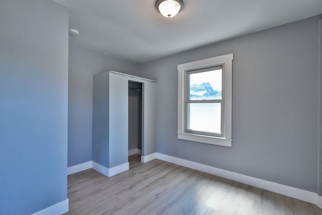14090 Pine St, Walnut Grove, CA 95690 - unfurnished bedroom featuring wood finished floors and a closet
