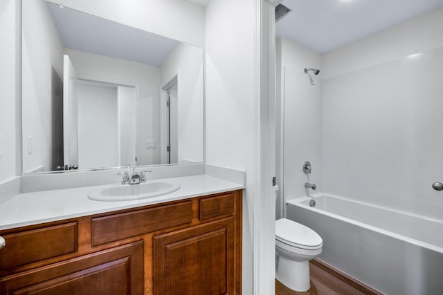 full bath with tub / shower combination, vanity, toilet, and wood finished floors