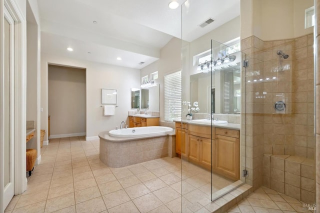 bathroom with vanity, independent shower and bath, and tile patterned floors