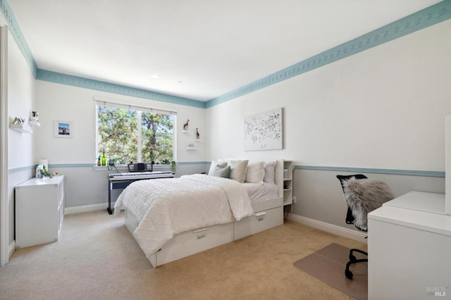 bedroom featuring light carpet