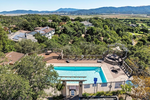 birds eye view of property with a mountain view